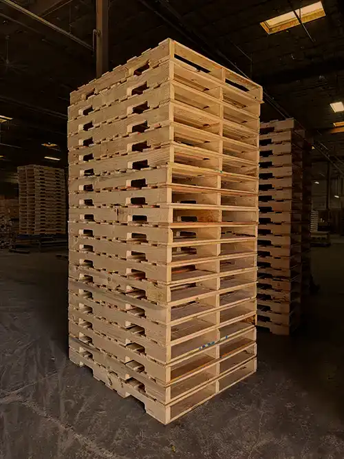 Stacked new wooden pallets with stringer construction
