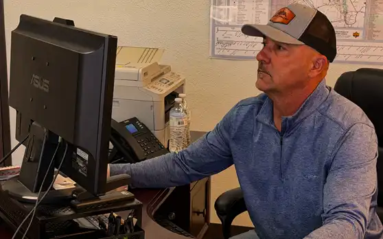 Dave Schnabel, president of Sierra Pallet, working at his desk